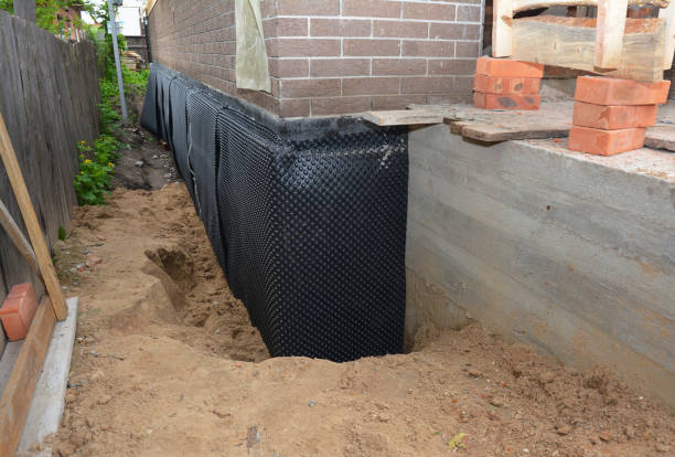 Happy homeowners after waterproofing job in Tigerton